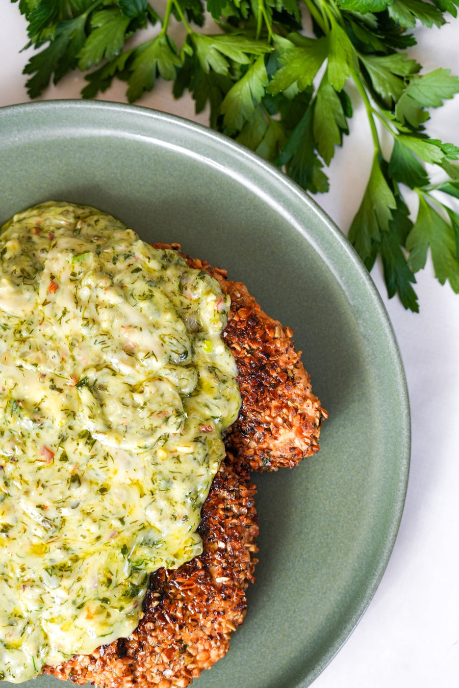 Hazelnut Crusted Chicken Schnitzel with Melted Cheese & Pesto