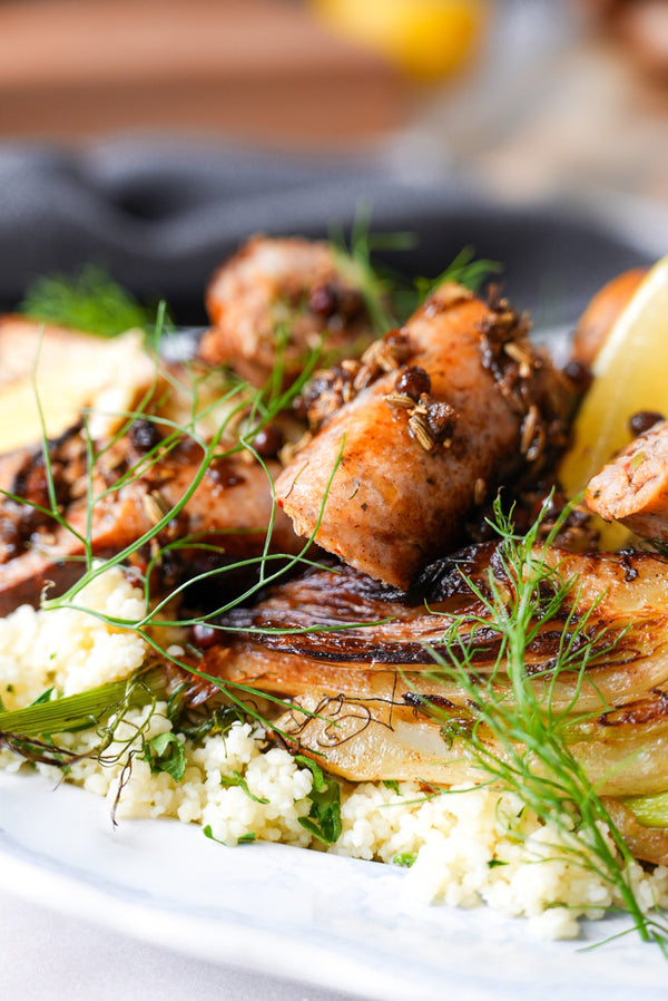 Italian Sausages with Caramelised Fennel, Herbed Couscous & Lemon Butter