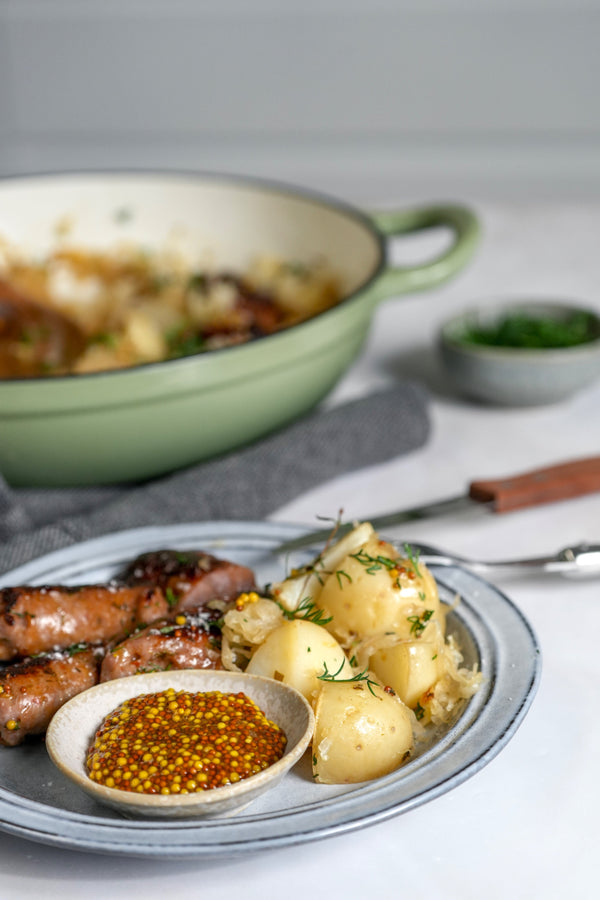 Bratwurst, Herby Warm Potatoes and Kraut