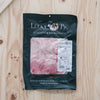 The Lucky Pig premium sliced leg ham in a 200 g retail pouch on a wooden board