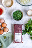 Packed beef mince with eggs, herbs and vegetables; serving suggestion