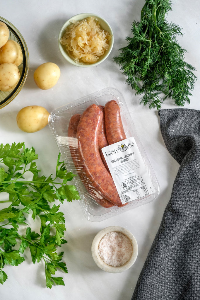Continental Bratwurst with potatoes, sauerkraut and herbs for a serving suggestion